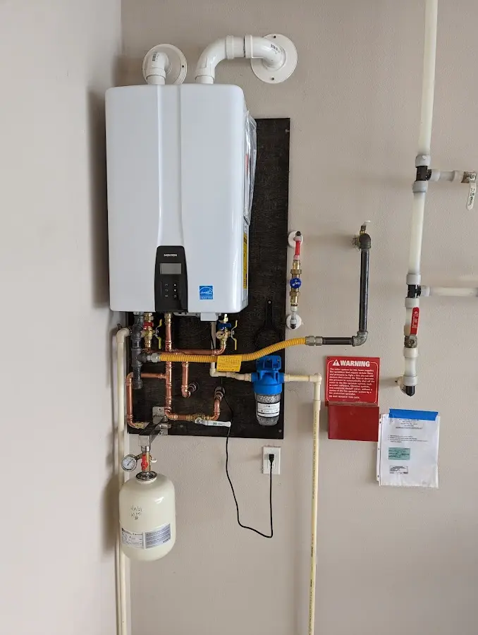 Professional plumber installing copper piping in a West Whittier-Los Nietos home